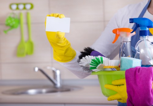 Cleaning professional entering a property with supplies