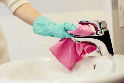 Office cleaning in Edgware with professional staff sanitising a modern workspace