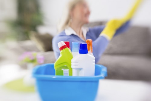 Cleaner wearing PPE during a professional cleaning job in Edgware
