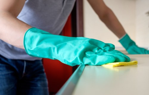 Office cleaners in Edgware sanitising desks and surfaces